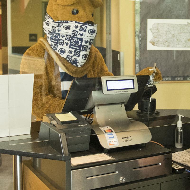 Nittany Lion swiping out hunger at the register in the dining commons